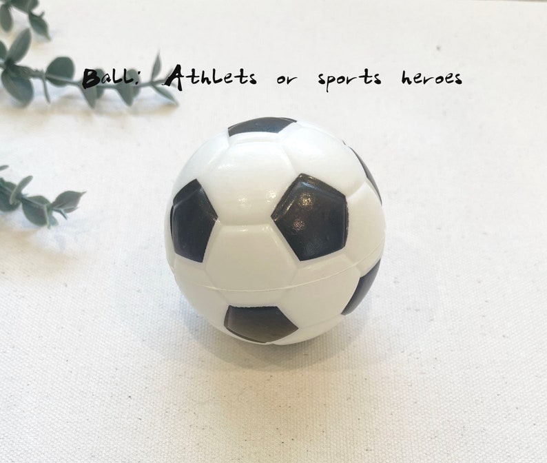 May include: A white and black soccer ball with a textured surface.