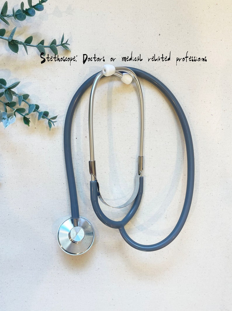 May include: A gray stethoscope with silver earpieces and a silver chest piece.  "Stethoscope: Doctors or medical related professions"