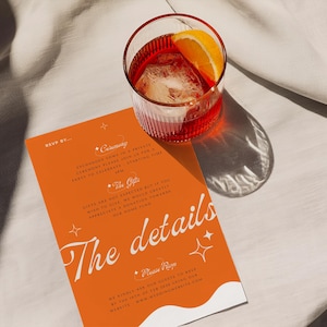 May include: Orange and white wedding invitation with the text "The details" in a white script font. The invitation has a white wave design at the bottom and stars in the top corners. The background is orange with a white border.