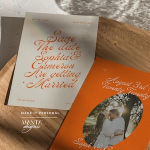 May include: Two wedding announcement cards. One is light gray with orange text that reads "Save the date Sophia & Cameron Are getting Married." The other is orange with a photo and text that reads "August 3rd, Twenty Twenty Six."