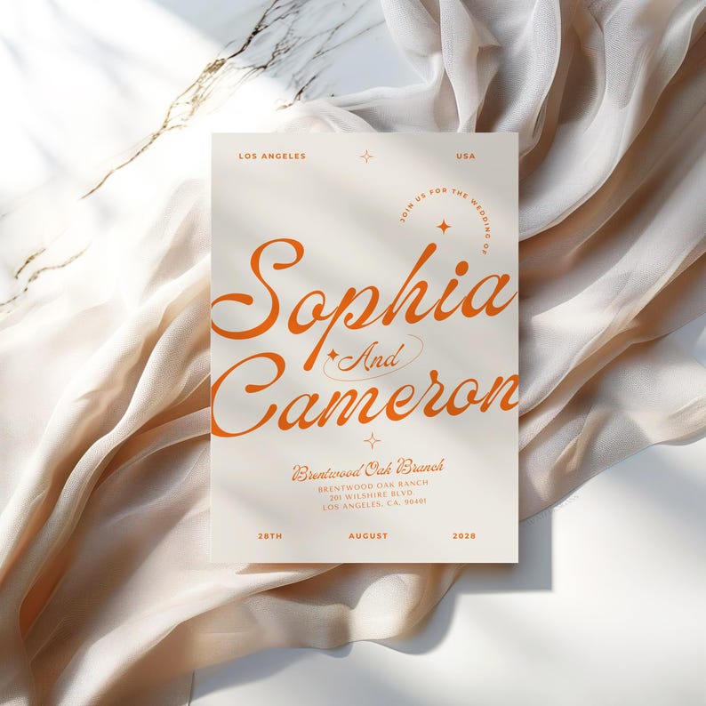 May include: A wedding invitation with a cream background and orange text. The invitation reads "Join us for the wedding of Sophia and Cameron" with a star and a circle around the text. The invitation also includes the date, August 28th, 2028, and the location, Brentwood Oak Branch, Brentwood Oak Ranch, 201 Wilshire Blvd., Los Angeles, CA 90401.
