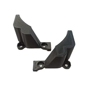 May include: Two black, angular brackets with mounting holes. The brackets have a textured surface and a unique, curved design. They are likely used for structural support or mounting purposes.