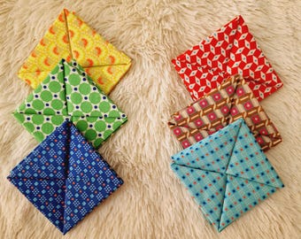 This square of fabric is a very practical purse for storing coins and bills, origami purse