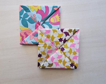 This square of fabric is a very practical purse for storing coins and bills, origami purse