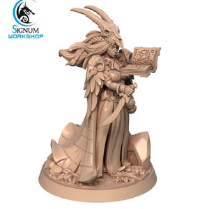 May include: A miniature figurine of a female figure with a horned headdress, holding a book with a pentagram symbol and a dagger. The figure is wearing a long robe with feathered wings and is standing on a rocky base.