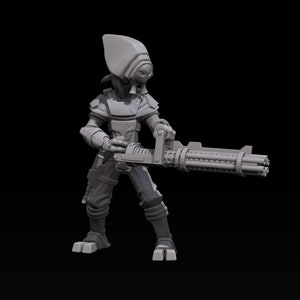 May include: A gray, detailed miniature figure of a humanoid alien holding a large, futuristic weapon. The figure has a large head with a single eye and a pointed helmet. The weapon has a long barrel with multiple barrels and a handle.