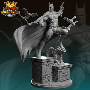 May include: A gray Batman statue with a cape, standing on a brick base with a gargoyle and bats. The statue is from Legion Miniatures 3D Printing Designs. The base has the text "Arkham Asylum" and other text.