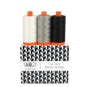 May include: Three spools of thread in white, gray, and black, labeled "Aurifil Color Builder Carrara Black/White"