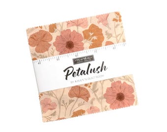 May include: A stack of square fabric pieces featuring a floral pattern in shades of peach, pink, and cream. A white paper band wraps around the center, printed with the text 'moda', 'Petalush', and 'BY KILEY'S QUILT ROOM', showing a 5-inch width.