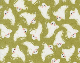 May include: A green fabric with a repeating pattern of white ghosts with pink cheeks. The ghosts are smiling and have a simple, cartoon-like design.