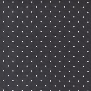 May include: A dark gray fabric with a repeating pattern of evenly spaced white polka dots. The dots are small and circular, creating a classic and versatile design. The fabric has a smooth texture.