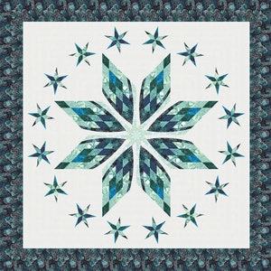 May include: A white quilt with a large blue and green starburst design in the center. The starburst is surrounded by a circle of smaller blue stars.