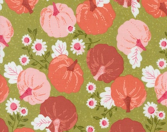 May include: A green fabric with a repeating pattern of pink, orange, and red pumpkins with white leaves and white flowers.