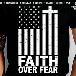 May include: A black t-shirt with a distressed white American flag design and a white cross. The text "FAITH OVER FEAR" is printed below the flag.