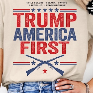 May include: A beige t-shirt with the text "TRUMP AMERICA FIRST" in red, white, and blue. Two crossed rifles are below the text, with red, white, and blue stars.