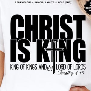 May include: White t-shirt with the text "CHRIST IS KING" in large, bold, black letters. Below, it reads "KING OF KINGS AND LORD OF LORDS Timothy 6:15". A black cross is centered between the phrases. The image also includes "SVG PNG DOWNLOAD FILES".