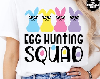 May include: White t-shirt with a graphic of four Easter bunnies wearing sunglasses and the text "Egg Hunting Squad".