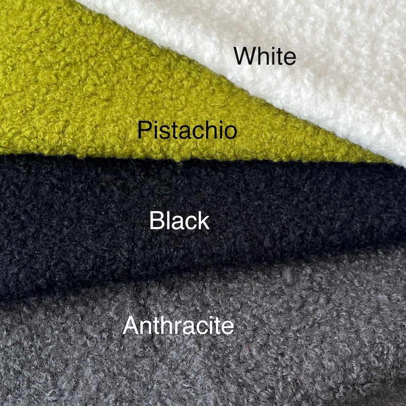 May include: Close-up of fabric samples in white, pistachio, black, and anthracite. The fabric has a textured, looped appearance. The colours are labelled with white text.