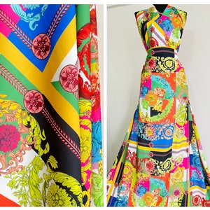 May include: Colorful fabric with a geometric pattern featuring chains, flowers, and ornate designs in shades of red, yellow, blue, green, and black.
