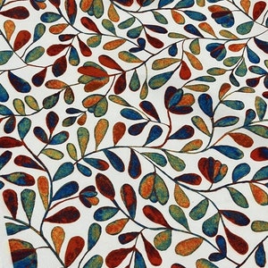 May include: White fabric with a repeating pattern of blue, green, orange, and red stylised leaves.
