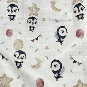 May include: White fabric with a repeating pattern of penguins, stars, moons, and balloons. The penguins are wearing different expressions and some are holding balloons. The fabric has a soft, textured feel.