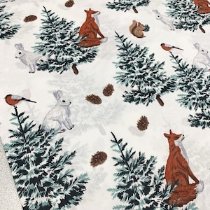 May include: A white background with a repeating pattern of red foxes, white rabbits, pine trees, brown pine cones, and red robins. The pattern is a winter woodland theme.