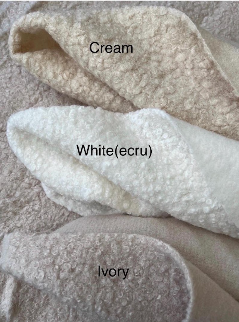 May include: Close-up of three fabric swatches in cream, white (ecru), and ivory. The fabrics have a textured, looped pile. The colours are labelled with text: "Cream", "White(ecru)", and "Ivory".