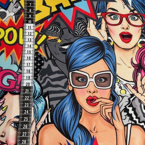 May include: A colorful fabric with a pop art design featuring women with bold makeup and sunglasses. The fabric has a textured surface and includes the words "BANG" and "POW!" in large, bold letters.
