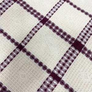 May include: White kitchen towel with a burgundy checkered pattern. The pattern features a repeating design of small circles and squares.
