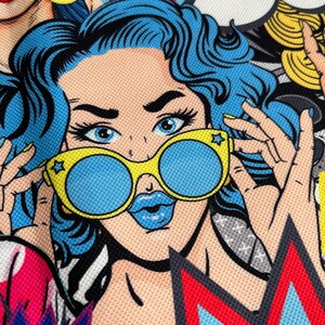May include: A colorful pop art style illustration of a woman with blue hair wearing yellow sunglasses with blue lenses. The woman is looking at the viewer with a surprised expression. The background is filled with colorful shapes and patterns.