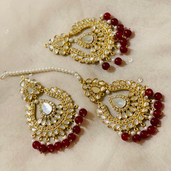 The Radiant. Radiant Red Tikka and Earrings Set with Shiny Stone Work