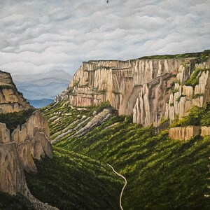 May include: A painting of a canyon with steep, rocky cliffs and a winding road in the valley below. The sky is cloudy and the cliffs are a light brown color.