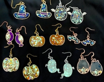 Pendientes de resina y brillantina que brillan en la oscuridad. Pendientes colgantes de Halloween.