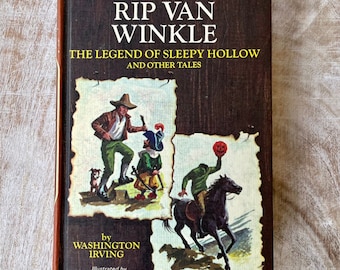 Könnte beinhalten: Ein Vintage-Buchcover mit Illustrationen von Figuren aus der Geschichte "Rip Van Winkle" von Washington Irving. Der Einband ist braun mit einem gelben Titel und dem Namen des Autors. Das Buch ist Teil der Companion Library-Reihe.