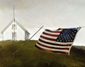 May include: A weathered American flag hangs on a clothesline in front of a white house with a tall, thin spire. The flag is faded and tattered, with some of the stars missing. The house is simple and unassuming, with two windows and a door. The scene is set against a cloudy sky.