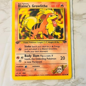 以下が含まれることがあります： 基本ポケモンのブーメランのポケモンカード。カードは黄色の縁取りで、燃えるようなオレンジと黄色のブーメランのイラストが表示されています。カードテキストには攻撃の説明とレベル20が含まれています。