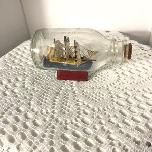Mini Pirate Ship in a Bottle – Handcrafted Nautical Decor – 4.5&quot; Collectible Maritime Souvenir