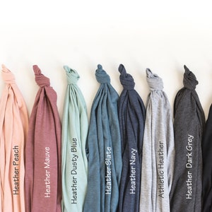 May include: A selection of t-shirts in various colors, including white, peach, mauve, dusty blue, slate, navy, athletic heather, dark grey, and black.
