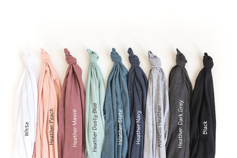 May include: A selection of t-shirts in various colors, including white, peach, mauve, dusty blue, slate, navy, athletic heather, dark grey, and black.
