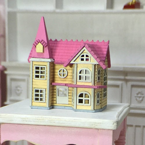 pink and yellow dollhouse