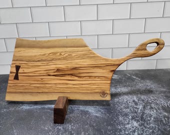 Live Edge Olive Wood charcuterie board. Single piece construction