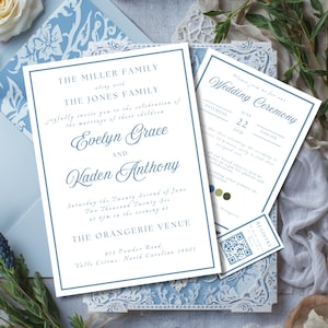 May include: Elegant wedding invitation suite in shades of blue and white. The main invitation features the names Evelyn Grace and Kaden Anthony, with event details. Additional cards include ceremony information and a registry card with a QR code. Floral accents complete the design.