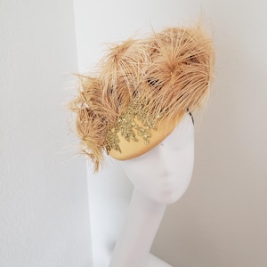 Champagne Gold Ostrich feather fascinator in all its glory for Derby, Royal ascot, wedding and all your special occasions.