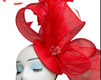 Exquisite sinamay fascinator, a true wearable work of art.