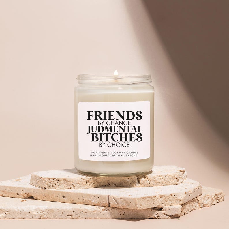a candle sitting on top of a pile of rocks