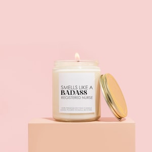 a candle sitting on top of a pink block