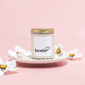a jar with a label on it sitting on a plate