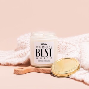a jar of cream next to a wooden spoon