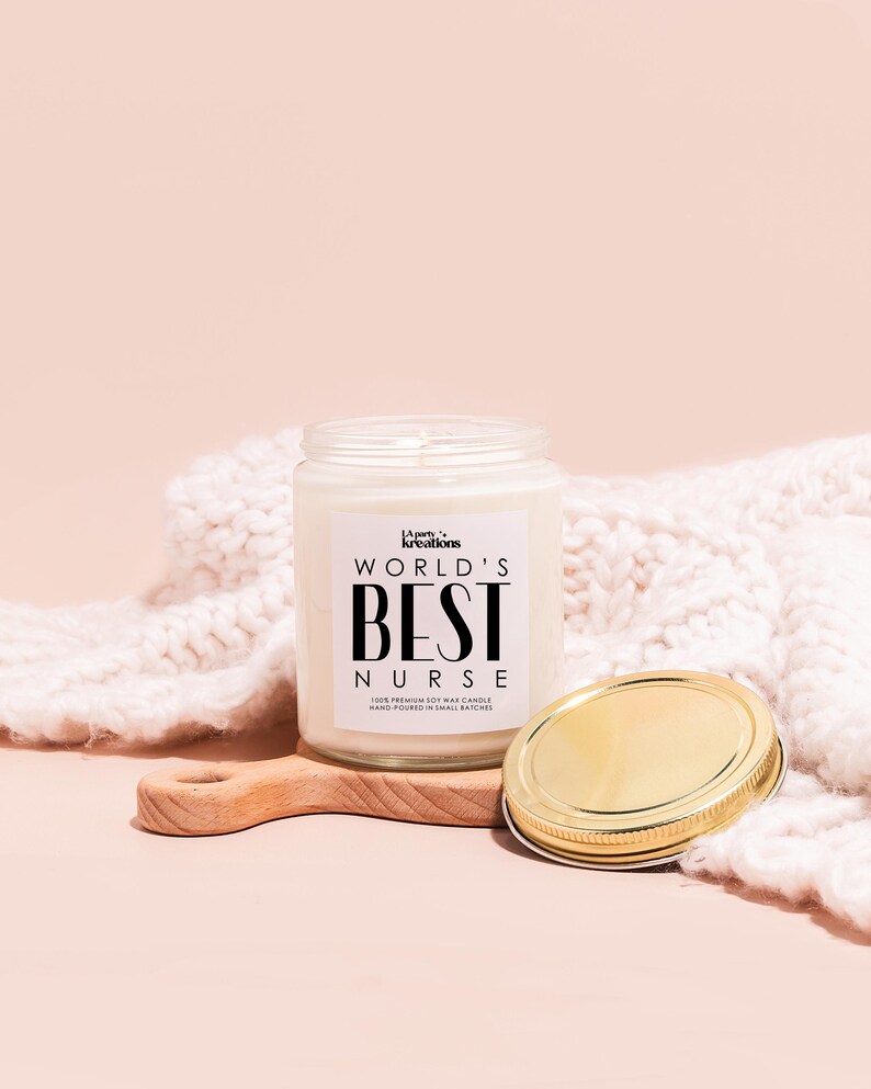 a jar of cream next to a wooden spoon