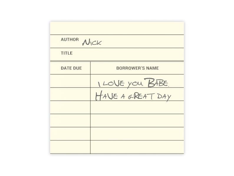 May include: A yellow library card with black lines and the text "AUTHOR NICK TITLE DATE DUE BORROWER'S NAME" and handwritten text "I LOVE YOU BABE. HAVE A GREAT DAY"